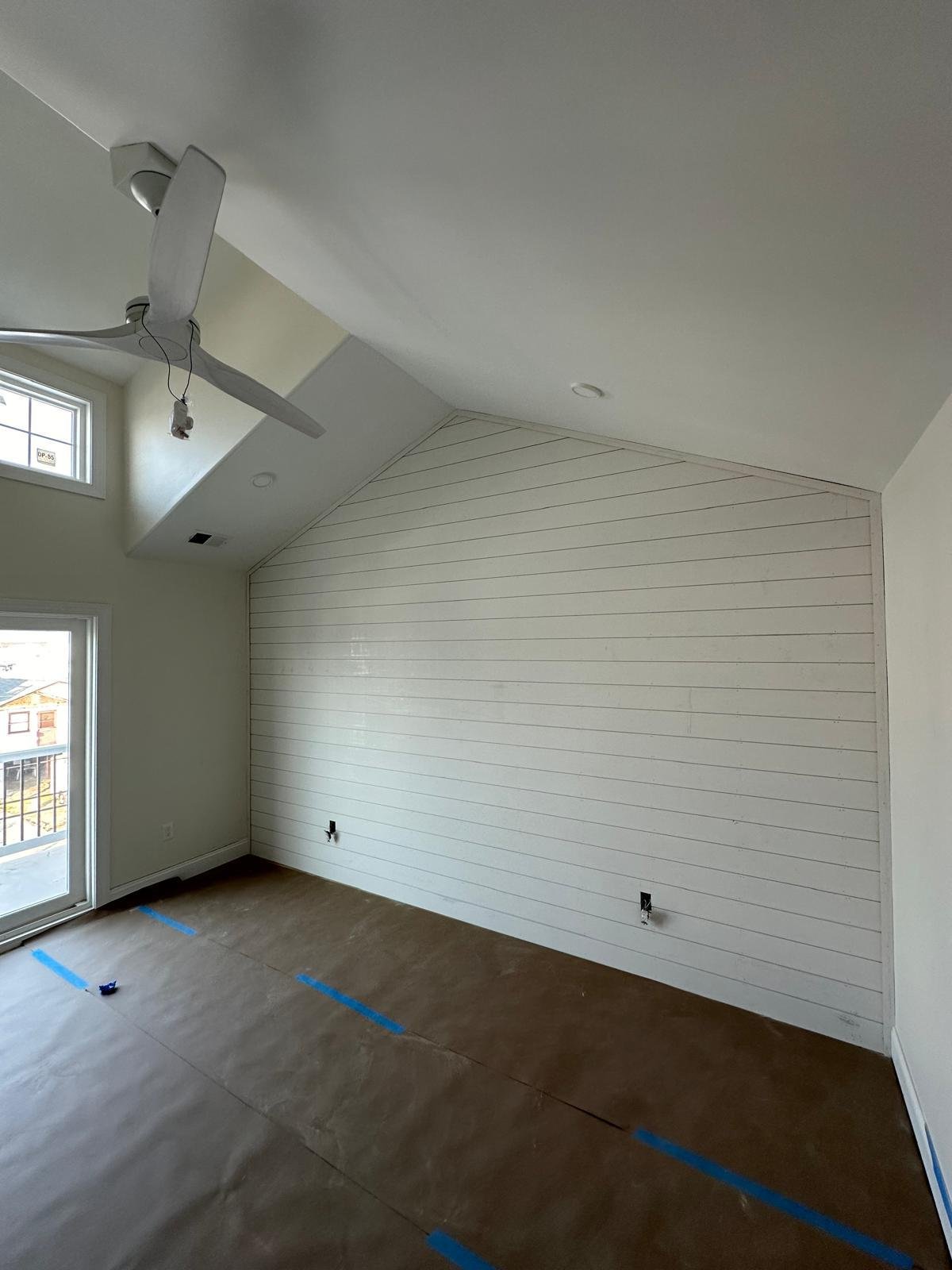 Completed white shiplap accent wall